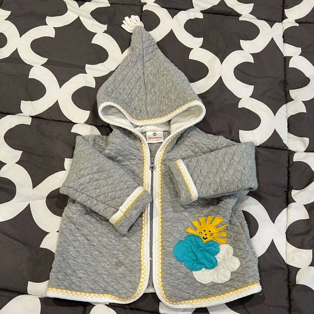 Baby coat with pointed hood